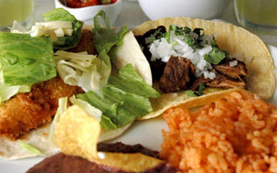Combo plates are a must. Here are two tacos — one fish, one pork — that come with rice, beans and a salad. The side of guacamole is not included, but highly recommended.