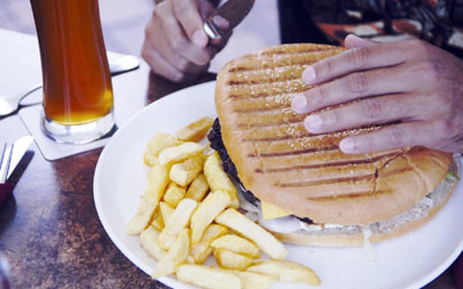 The “1/2 size” hamburger at The Big Emma in Ramstein village, Germany, is not for the faint of appetite. The family restaurant is especially popular with Americans.