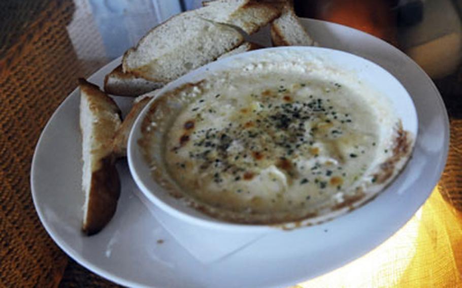 Bubbling Camembert fondue is one of the appetizers at the restaurant.