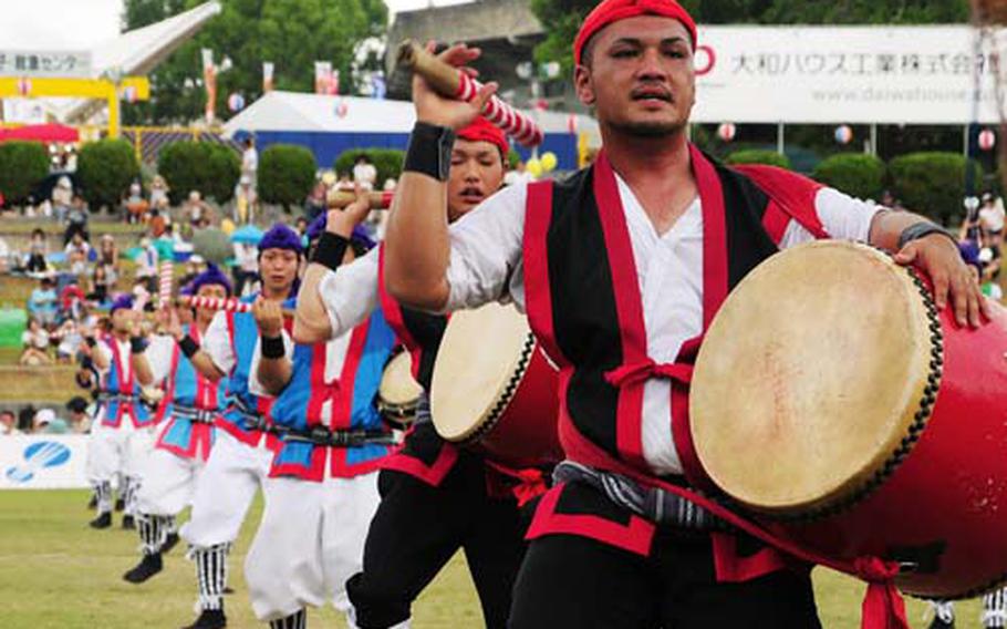 A member of one of about 35 Eisa Dance groups bangs his drum Sept. 13 during the 54th Annual All Okinawa Eisa Festival at Koza Sports Park, Okinawa. The event, more commonly known as the Orion Beer Festival, attracts huge numbers of attendees who enjoy drinking the local beer, eating local specialty foods and trying their skills at carnival-type games.