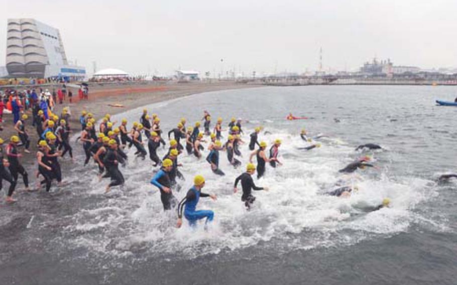 Racers enters the water at the 23rd Annual Kawasaki-American Friendship Triathlon Oct. 23. The event consisted of a 1,500 meter swim, 40 kilometer bike ride and 10 kilometer run.