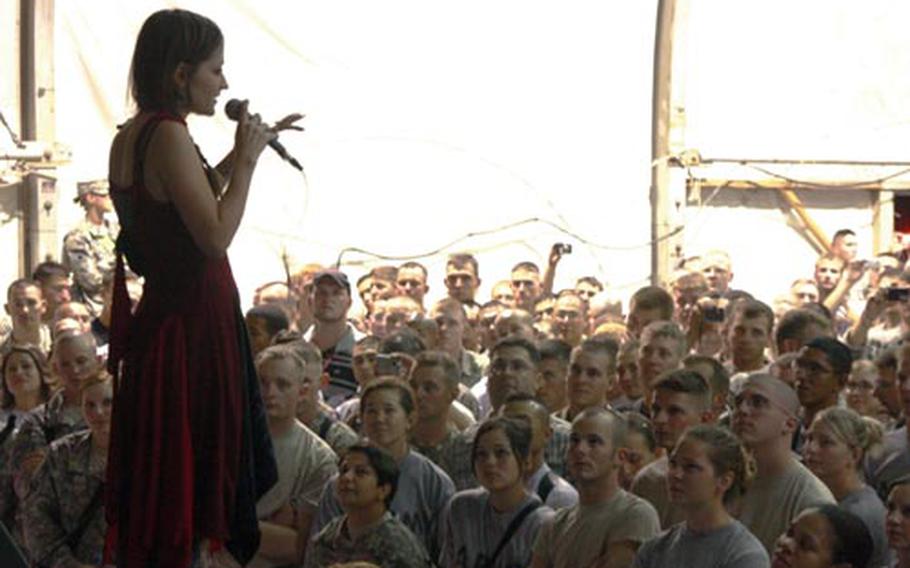 Lacey Mosley Sturm, lead singer of the Texas-based band Flyleaf, performs a concert for the servicemembers at Bagram Air Field, Afghanistan, on July 6 at the Morale, Recreation and Welfare Clamshell.