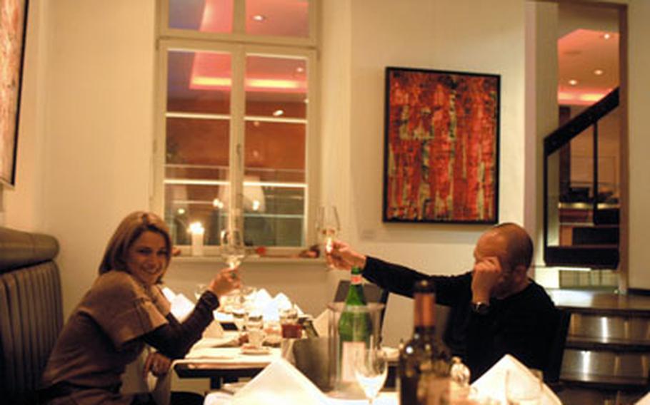 A happy couple toast each other at the Restaurant Romer in Heidelberg, Germany. The restaurant, though a bit pricey, offers a variety of creative dishes and an inviting setting.