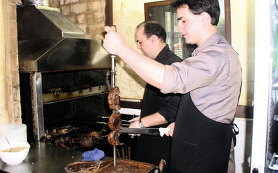 At the Fogo Grill in Pyeongtaek, South Korea, owner Adriano Dos Santos De Lara gets ready to bring a skewer of steak to a customer’s table. Fogo specializes in all-you-can-eat Brazilian barbecue, serving nine meats one after another, then keeping the meats coming until the customer’s had enough.