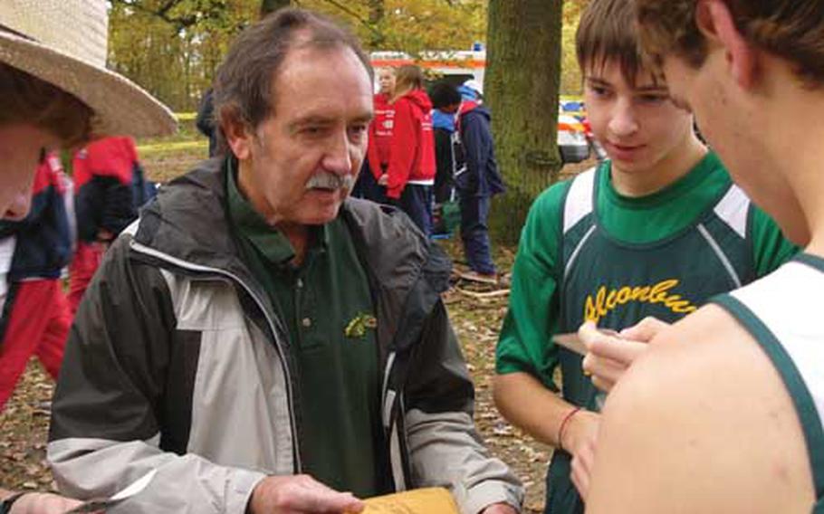 Bud Foutz, shown advising Alconbury cross country runners in October, has an overseas market for his Native American-themed novels.