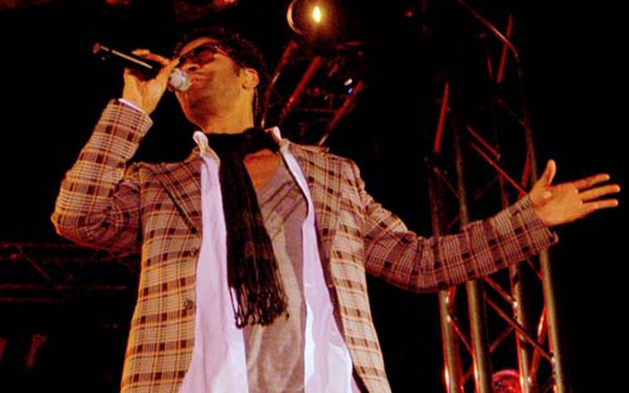 R&B artist Eric Benet performs at Yokosuka Naval Base’s Benny Decker theater on Monday. A few hundred people showed up to hear the singer perform some of his hits, including “You’re the Only One” and “Spend My Life With You.”