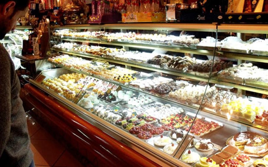 Rows of freshly baked pastries, from the flaky sfogliatella to the rum-filled baba, line the pastry case at Champs Elysees.