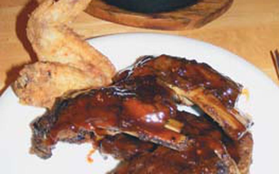 Stacks’ barbecue ribs, chicken wings and a pan of sweet cornbread — it doesn’t get much better than this.