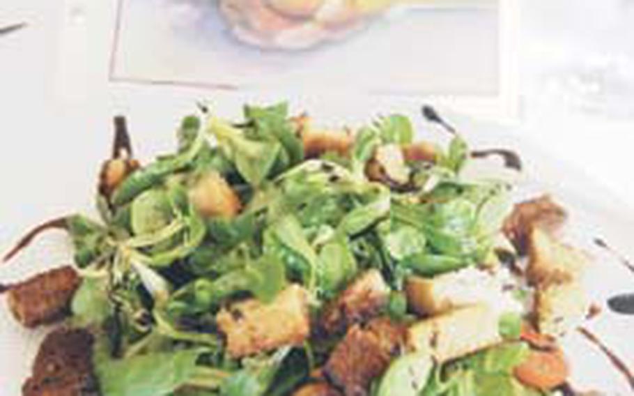 The Feldsalat salad features fresh plum tomatoes, homemade croutons and balsamic dressing.