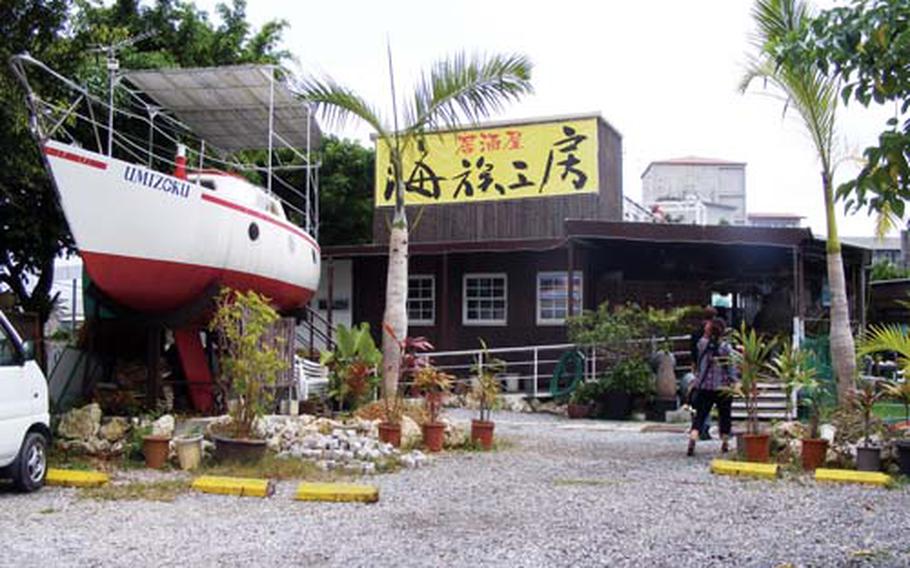 A sailboat that seats eight to 10 people is the first thing to greet visitors at the Umizoku Kobou, or Ocean Family Studio, in Okinawa City.