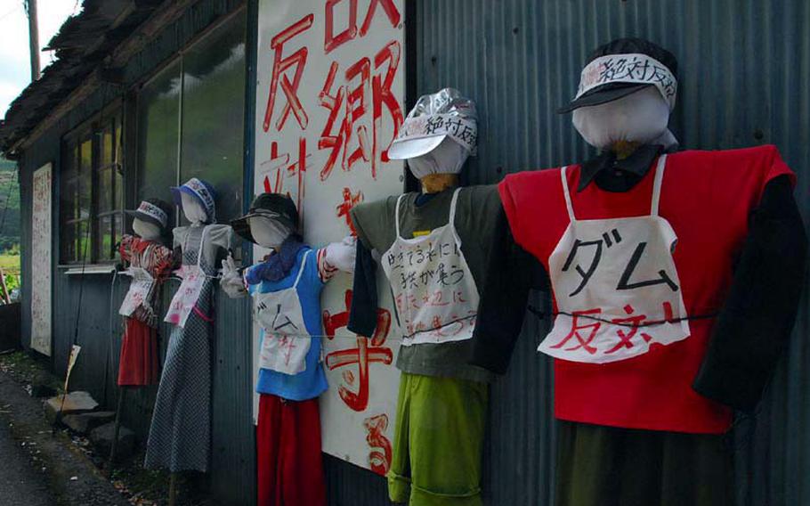 Dummies stand in protest of the Japanese government's plan to flood part of the Ishiki Valley to bolster the public water supply.