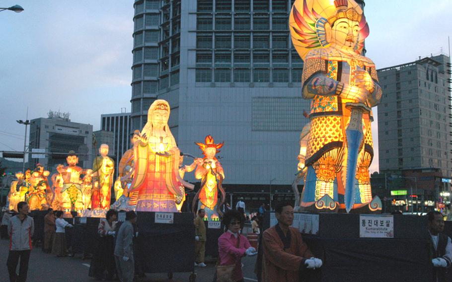 The Lantern Parade, the highlight of the Lotus Lantern Festival in Seoul, featured paraders carrying thousands of specially made, brightly lit, statuesque images. The annual festival observes Buddha's birthday.
