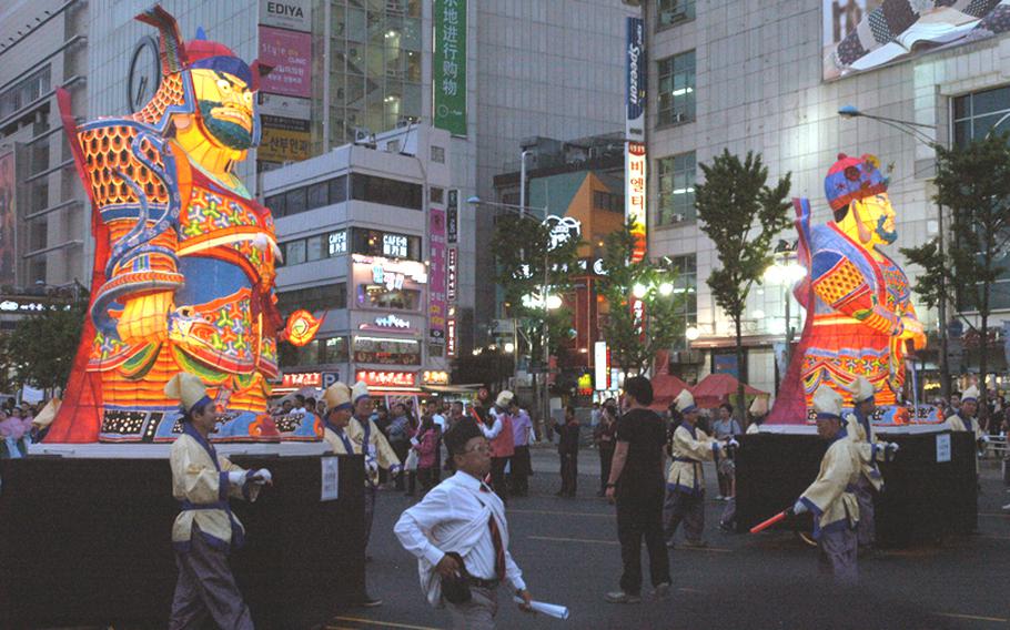 The Lantern Parade, the highlight of the Lotus Lantern Festival in Seoul, featured paraders carrying thousands of glowing, statuesque images May 16. The annual festival commemorates Buddha's birthday.