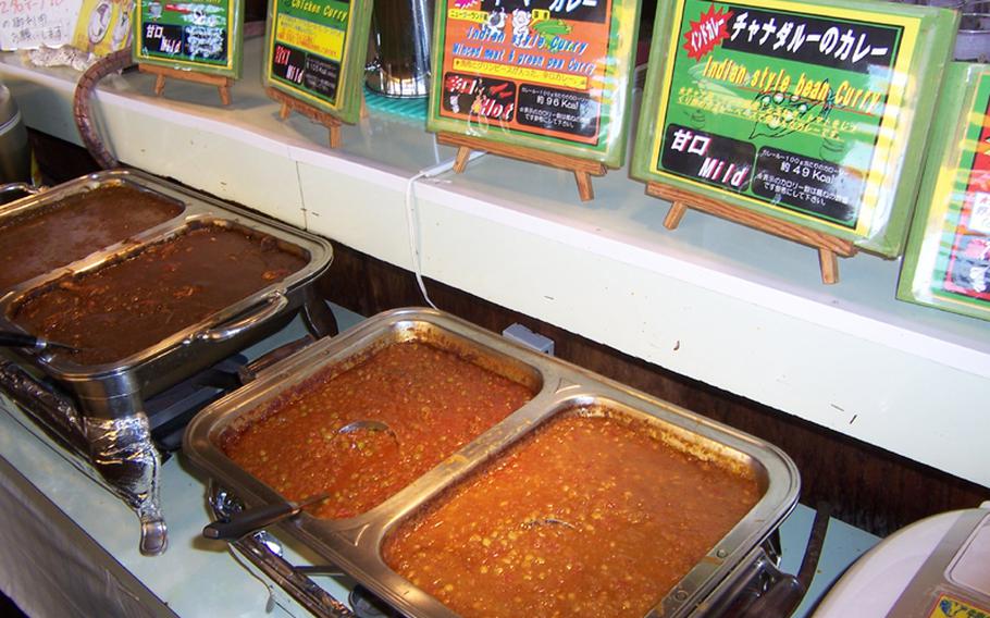 Various types of Indian curries on offer at Okinawa&#39;s Fab Curry Buffet restaurant. Sticky rice is also available, as are two curries from Thailand.