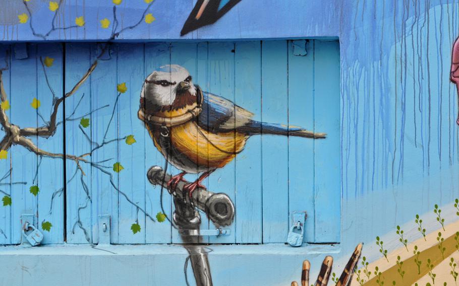 This mural of a perching bird, painted in front of a shuttered window that makes it almost appear as if it is in a cage, is near the Theodore Heus Bridge in Mainz-Kastel, Germany. It will be painted over this weekend by other graffiti artists.