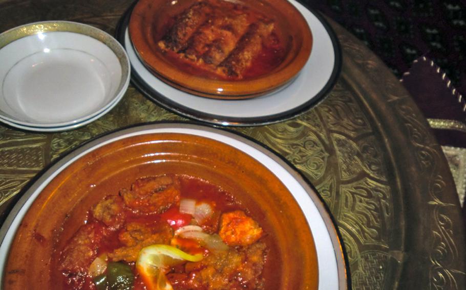 A fish dish and enchilada dish at Nefertiti Tokyo.