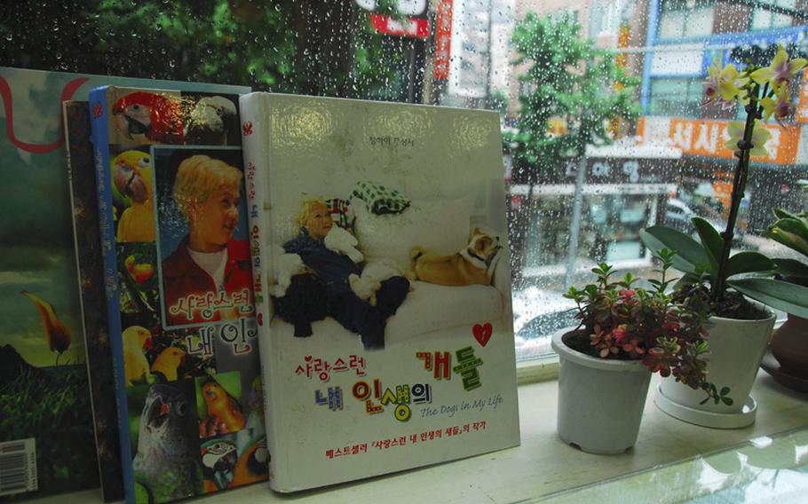 Books about Supreme Master Ching Hai and her conversations with her pets are on display beside a table in the Loving Hut, a vegan restaurant near Hannam Village in Seoul. The restaurant is part of an international chain affiliated with Hai.