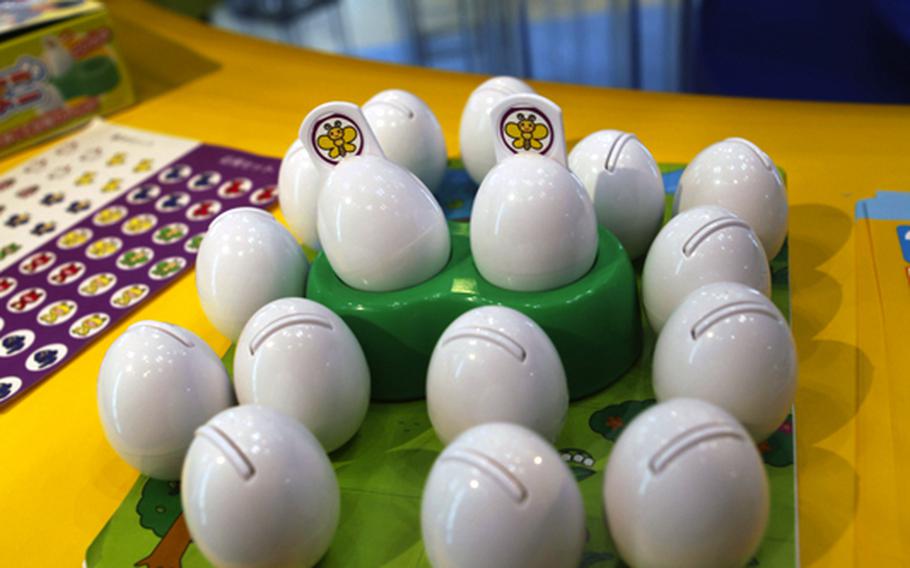 Memory Tamago is a game similar to 'Concentration,' played with toy eggs.