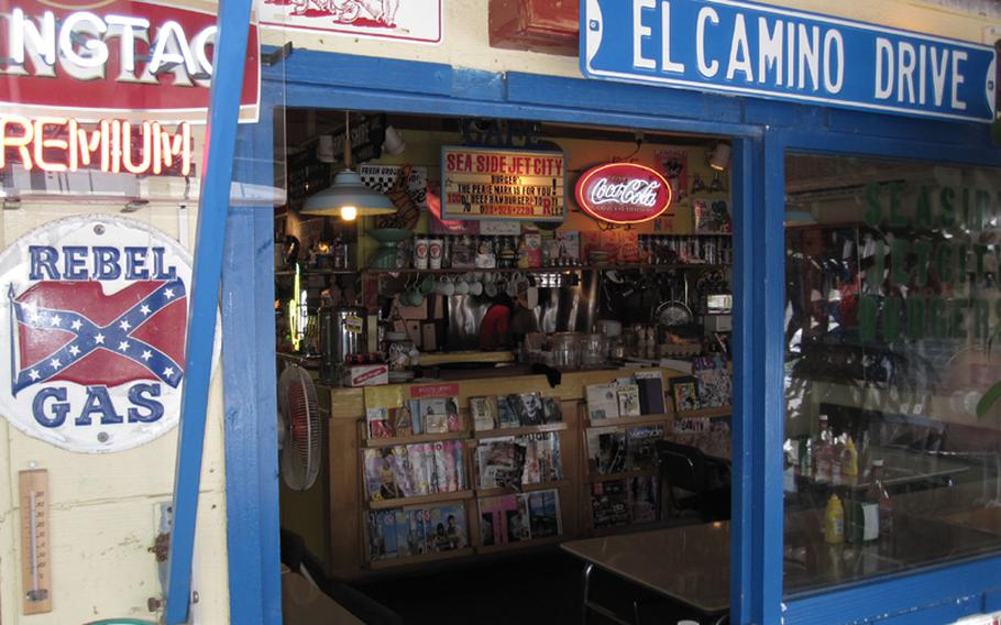 Vintage signs and other Americana memorabilia cover the walls and shelves of Sea Side Jet City Burgers on Okinawa.