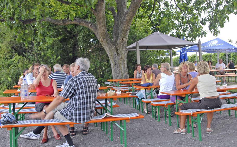 Park benches placed underneath trees, sun umbrellas near a reconstructed watchtower and vineyards stretching out in all directions make a perfect spot to get in the mood for the summer's wine festivals.