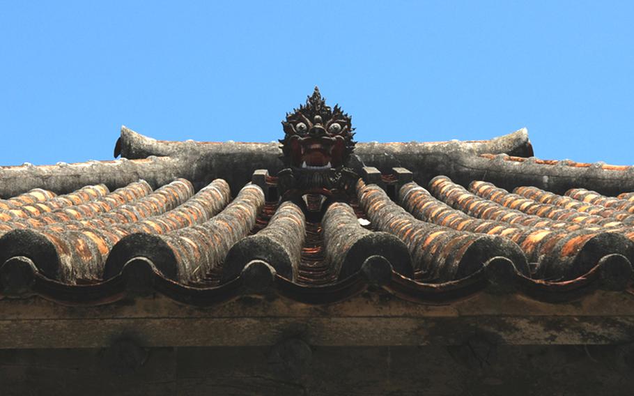 The main building at Nakamura House has a shi-sa, or lion dog, perched in the center of the roof, atop traditional Okinawan red tiles. The shi-sa is said to drive away unwelcome spirits.