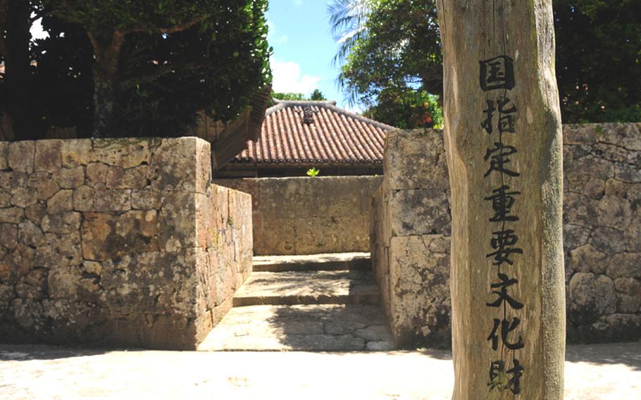 The entrance to the Nakamura House is located just across the narrow road from the visitor's center. Entering the main gate, the large, horizontal stone wall at the end of the short walkway is called the Hinpun and separates the house from the main gate. It's intended to prevent evil spirits from entering the residence.