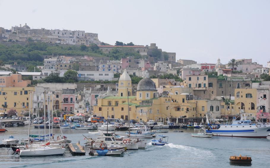 Signature multi-colored homes and buildings spruce up the muted tan of the tufa rock from which the island's homes and buildings were created.