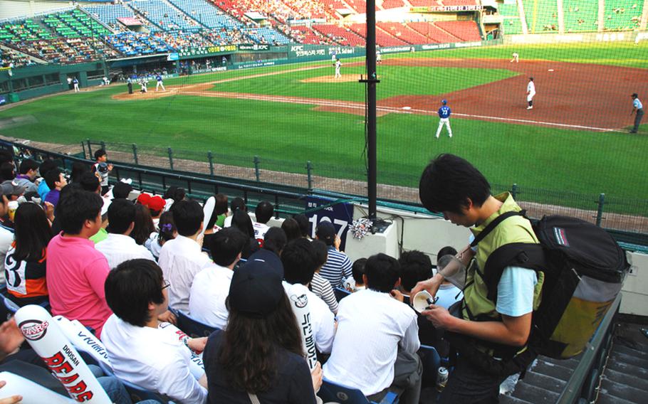 In this file photo from 2010, a vendor sells beer at Seoul's Jamsil Stadium during a South Korean professional baseball game between the Doosan Bears and the Samsung Lions.