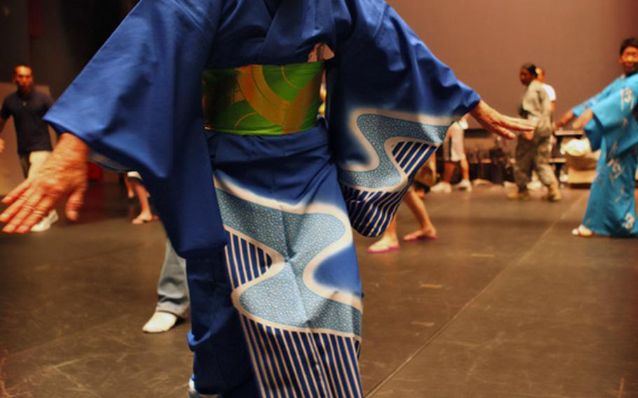 Toyoko Akutagawa, a member of the Zama City Women&#39;s Association is one of the two instructors teaching people at Camp Zama, Japan, how to perform the Bon Odori or bon dance.