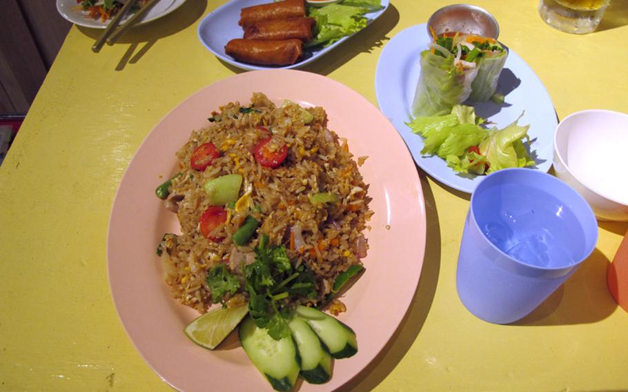 Fried rice with chicken, pork and vegetables; fried spring rolls; and cold spring rolls are simple but affordable Thai dishes at the recently opened Khaomangai Route 16, just a few minutes&#39; walk from the main gate at Yokota Air Base in Japan.