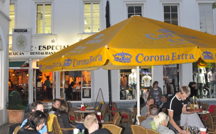 Golden Corona umbrellas distinguish Café Especial  from the surrounding restaurants in the heart of Saarbrücken's St. Johannes Markt.