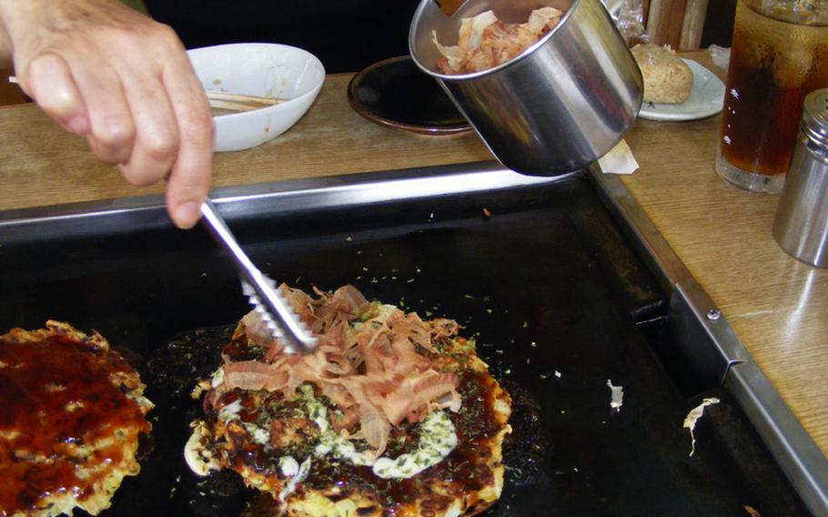 Bonito flakes are the perfect topping for Osaka-style okonomi-yaki, grilled at your table.
