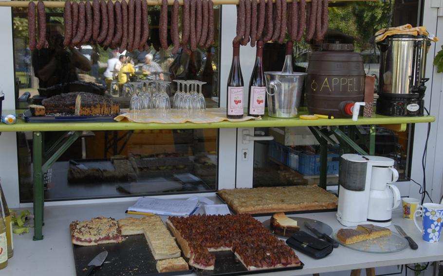 Sausage, cake and apple juice is sometimes offered outside the farm store at Appel Happel near Mainz, Germany, for customers to enjoy.