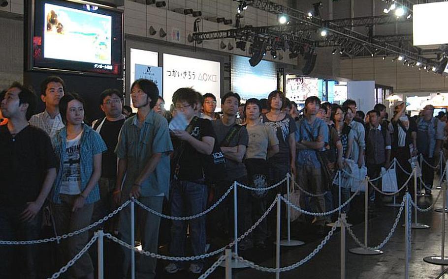 A crowd lines up to play a video game Saturday during the Tokyo Game Show. The highlight of the annual event is the public gets a chance to play pre-released games. Waiting time for some popular games was over three hours.