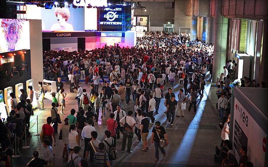 Gamers pack the Tokyo Game Show 2010 exhibition Saturday in the Makuhari Messe convention center in Chiba, Japan. Officials said the four-day show drew a record-setting number of visitors -- 207,647.