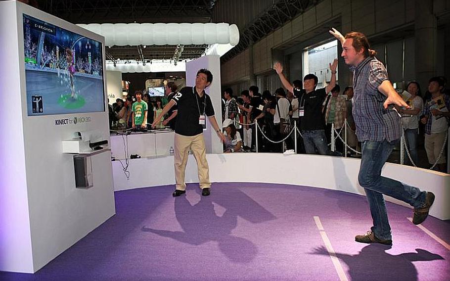 A gamer tries his hand at figure skating with the X-Box 360 Kinect controller Saturday at the Tokyo Game Show 2010.