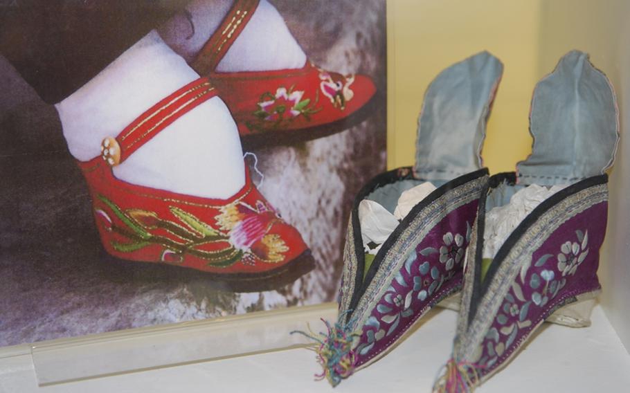 These silk slippers from China illustrate how tiny grown women were able to get their feet by the now banned practice of feet binding. Small feet were once a status symbol in China.