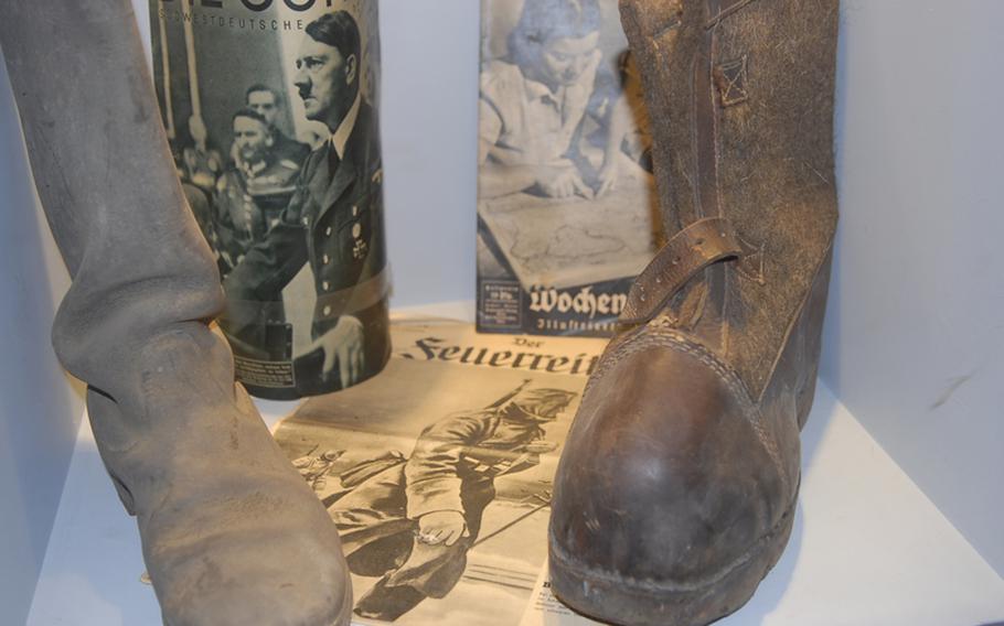 These military boots were worn by German soldiers during World War II. The big boot on the right was designed to help feet weather the Siberian winter.