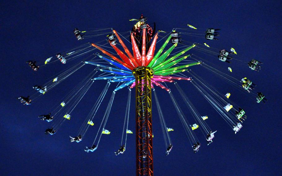 Festival goers take a spin on a swing ride in the fairgrounds of Oktoberfest in Munich on the first day of the 2010 festival. Beer tents are surrounded by carnival rides to make the festival more than just a beer-drinking event.