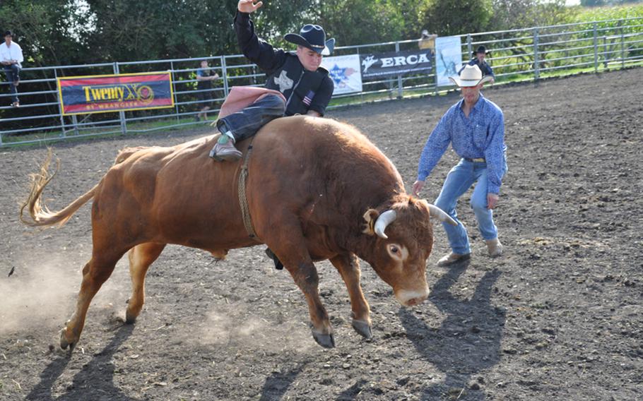 Senior Airman Matt Morris, 22, a Junction, Texas, native who is currently stationed at Spangdahlem Air Base, Germany, rides Limousine Sept. 4 at a Rodeo America event in Russheim, Germany.