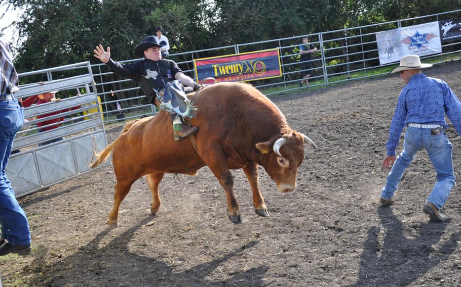 Senior Airman Matt Morris, 22, a Junction, Texas, native who is currently stationed at Spangdahlem Air Base, Germany, rides Limousine Sept. 4 at a Rodeo America event in Russheim, Germany.
