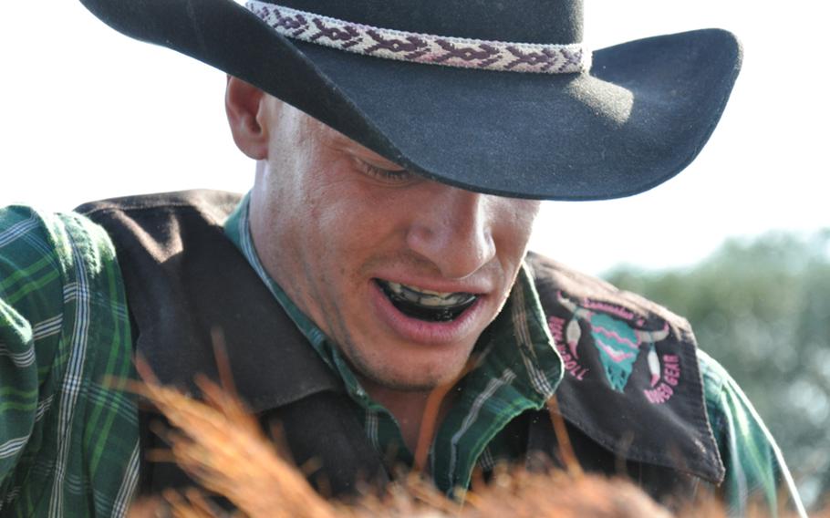 Spc. Robert Encinio, a native of New Mexico who is stationed in Grafenwöhr, Germany, prepares for the gate to open during the recent  Rodeo America event  in Russheim, Germany.