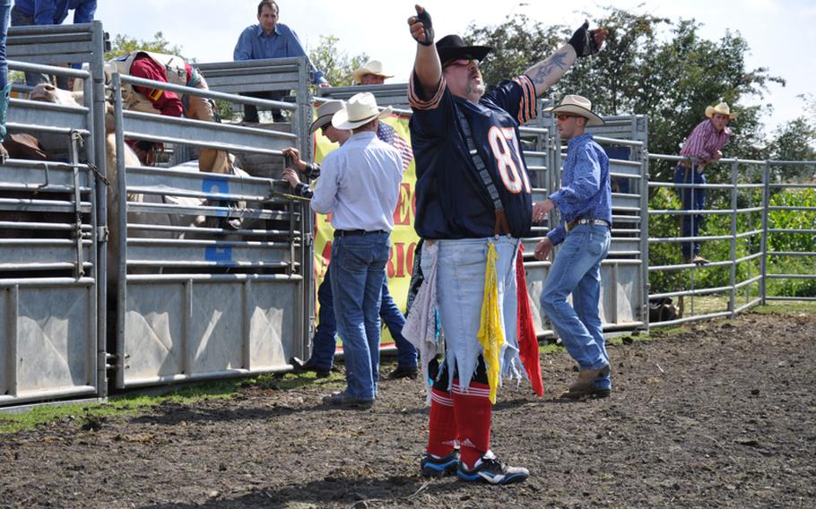 One of the rodeo bullfighter clowns, Uze, pumps up the crowd up prior to the bull-riding event at the rodeo in Russheim, Germany, on Sept. 4.