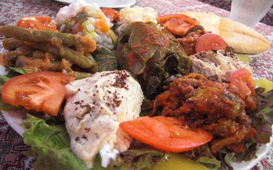 A platter of Assorted appetizers surrounding a stuffed green pepper is a good way to sample the Turkish cuisine at Okinawa's Istanbul Kebab House.