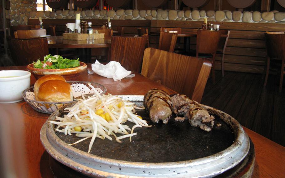 The hamburg steak at Stone Burg is cooked medium-well, but it has the softness of medium-rare meat. The corn and bean sprouts are yet another reminder that diners are getting Western food adapted to Japanese tastes. The restaurant is near the Yokosuka Chuo train station in Yokosuka, Japan.