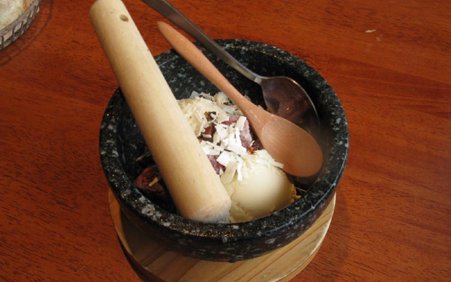 The stone ice cream gives diners a pestle to take out their aggression on vanilla ice cream and frozen fruit. The dessert is served in a cold stone bowl at Stone Burg, a steak restaurant near Yokosuka Naval Base, Japan.