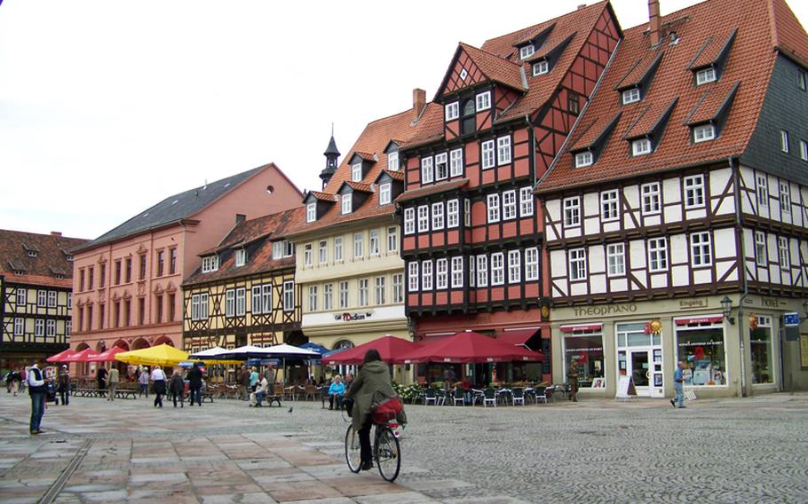 Colorful, half-timbered cafes, restaurants and other businesses border Quedlinburg's main square. The square is a popular place for visitors and local residents to congregate in the afternoons.