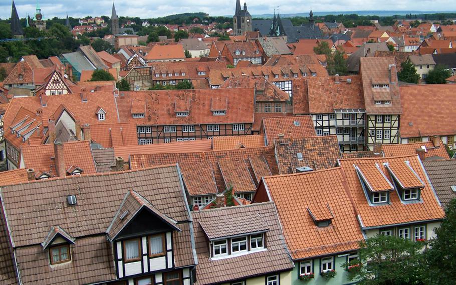 A bird's-eye view of Quedlinburg from the town's castle courtyard shows the red roofs covering its many half-timbered houses. 
