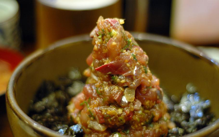 A tower of marinated horse mackerel on rice. Fresh seafood is one of the great attractions of Izu Peninsula.