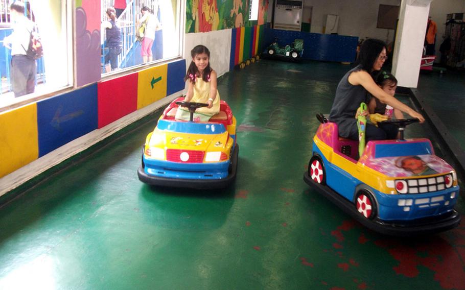 Natalya Jimenez avoids bumping into another car during a day of fun at the Children's Grand Park in Seoul.